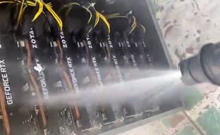 Watching miners hose down video cards, preparing them for sale