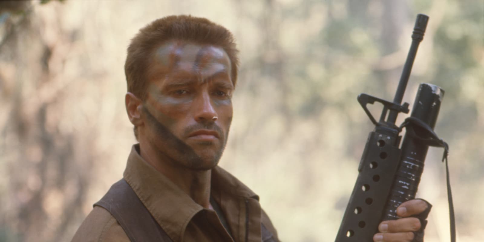 Arnold Schwarzenegger smiling at an event