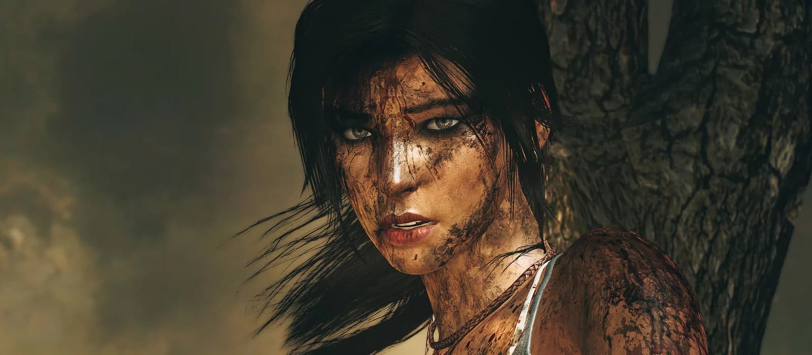 Tomb Raider (2013) on mobile, showing Lara Croft with optimized graphics.