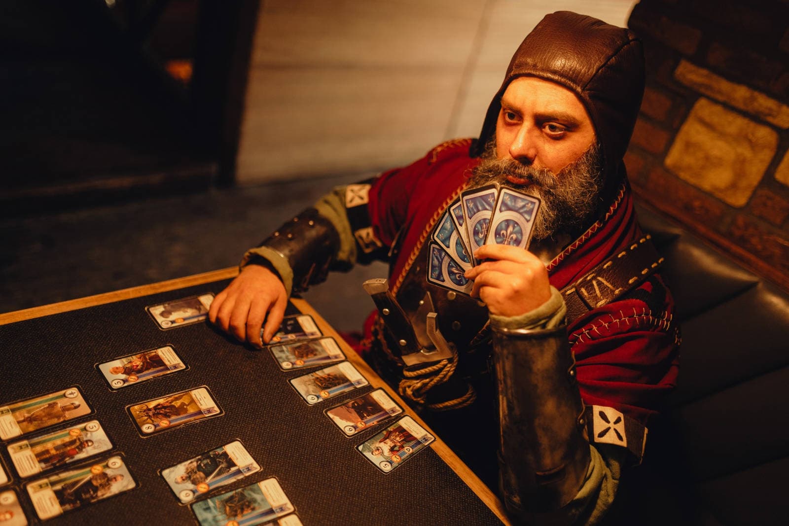 Cosplayer Vincent Wintermute as The Bloody Baron in a tavern setting, ready for Gwent