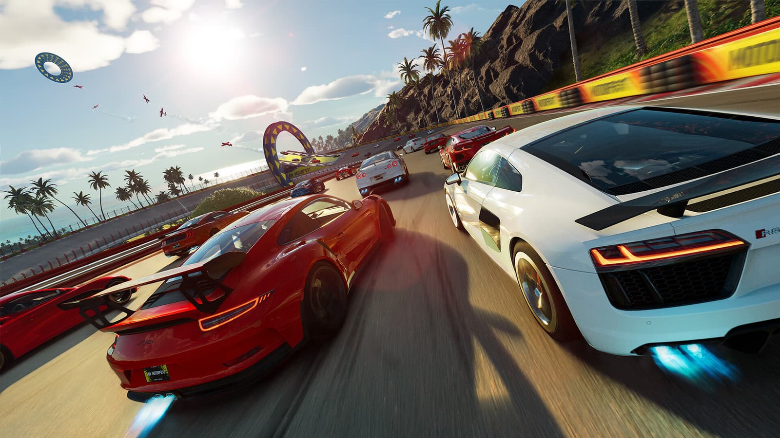 A vibrant screenshot from The Crew Motorfest, showing a car racing on a scenic road.