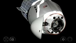 Crew Dragon spacecraft with cosmonaut Fedyaev and three astronauts docked with the ISS