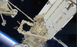 Российские космонавты провели в открытом космосе почти восемь часов и запустили студенческий наноспутник