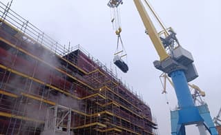 Backup generator loaded onto the under-construction icebreaker "Leningrad" using a gantry crane
