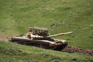 Tankers on T-72B3M with standard "barbecue grills" practiced firing from a 14.5 mm caliber insert barrel at a training ground in Tajikistan