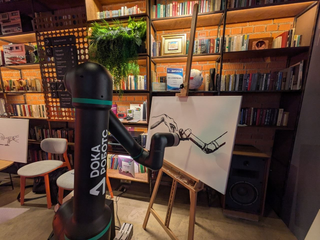 Russian industrial cobot DOKA transformed into an artist and reinterpreted "The Creation of Adam"