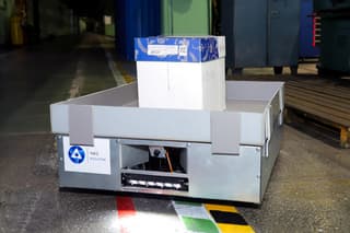 There are analogs, but why, if it can be 33 times cheaper: ChMP designed and operates a robot trolley that adheres to red lines