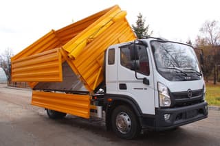New dump truck based on "Valdai 12" with YaMZ-534 engine developed in Russia: unloads on three sides
