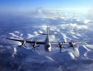 Tu-95MS strategic missile carriers and Su-33 fighters fly over the Barents Sea