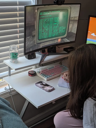 Girl using a notebook for Fallout hacking