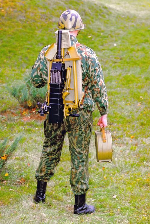 AGS-30 behind a fighter's back