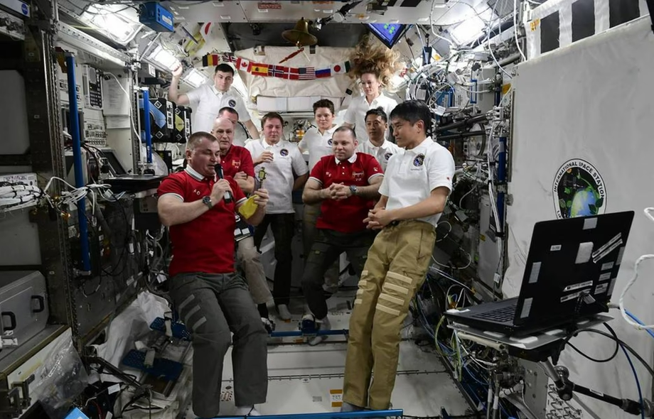Aleksey Ovchinin, Ivan Vagner, and Donald Pettit hand over the key to the ISS to Japanese astronaut Takuya Onishi