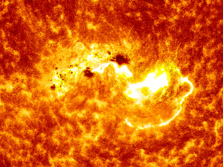 A close-up image of the Sun taken by NASA's Solar Dynamics Observatory shows a large sunspot and a solar flare source region