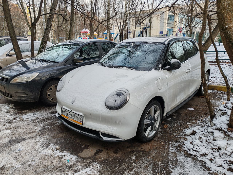 Cars in winter in one of Moscow courtyards