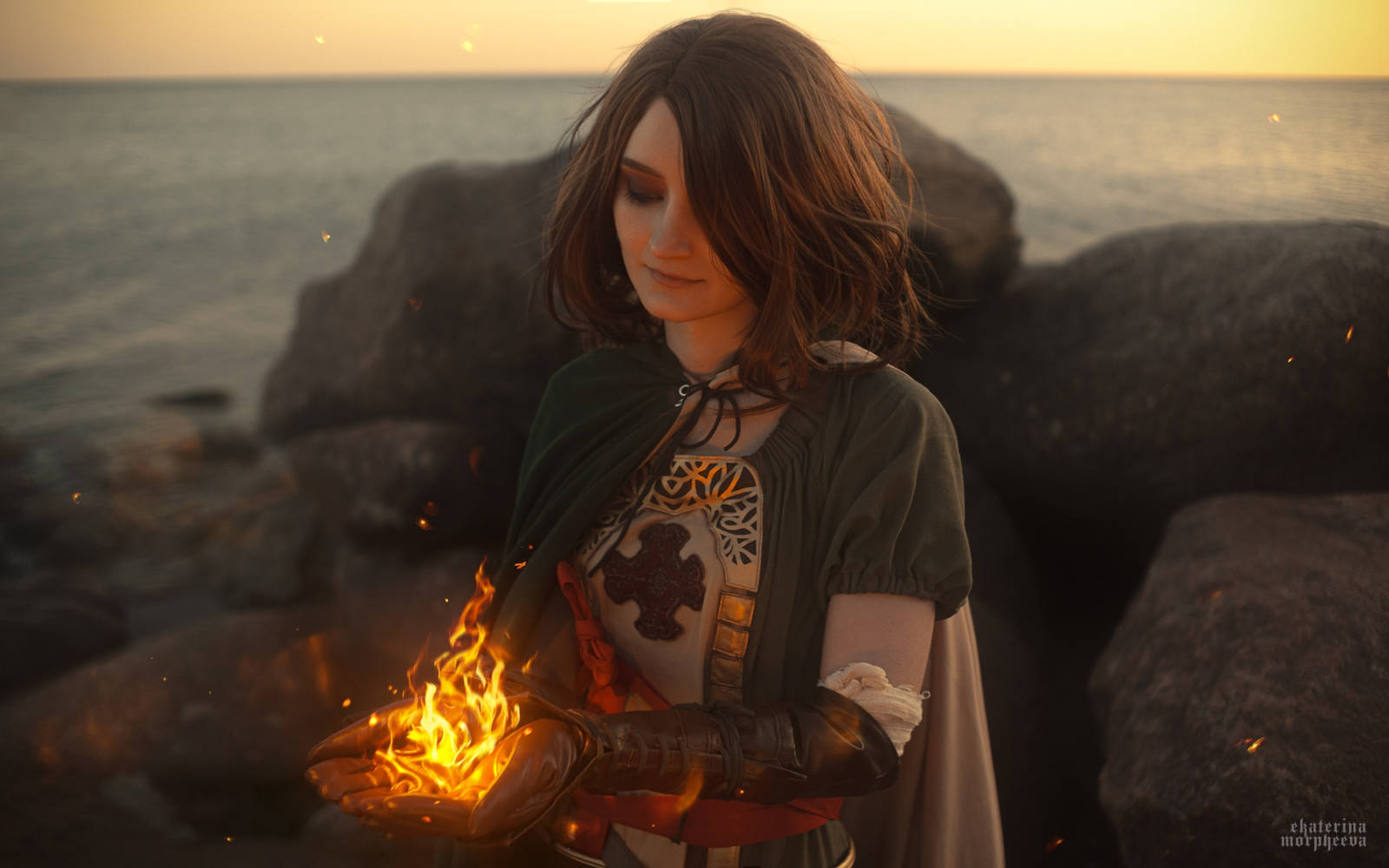 Reganight as Emerald Herald, close-up shot of her face and green cloak