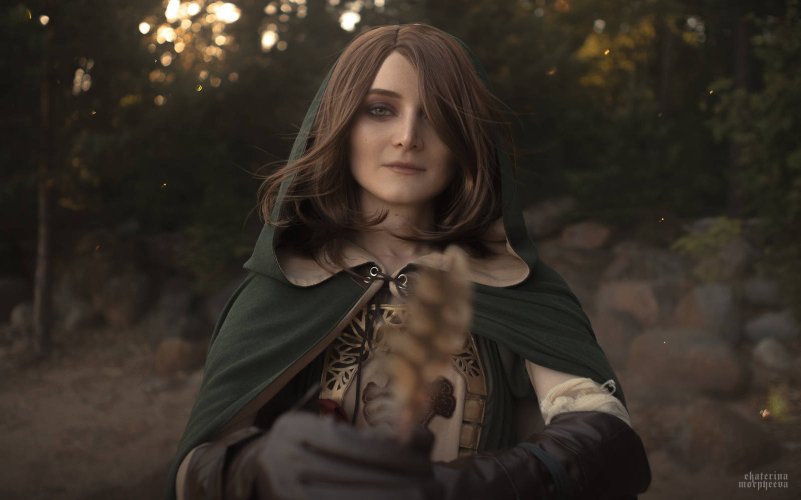 Reganight as Emerald Herald, looking directly at the viewer with a thoughtful expression
