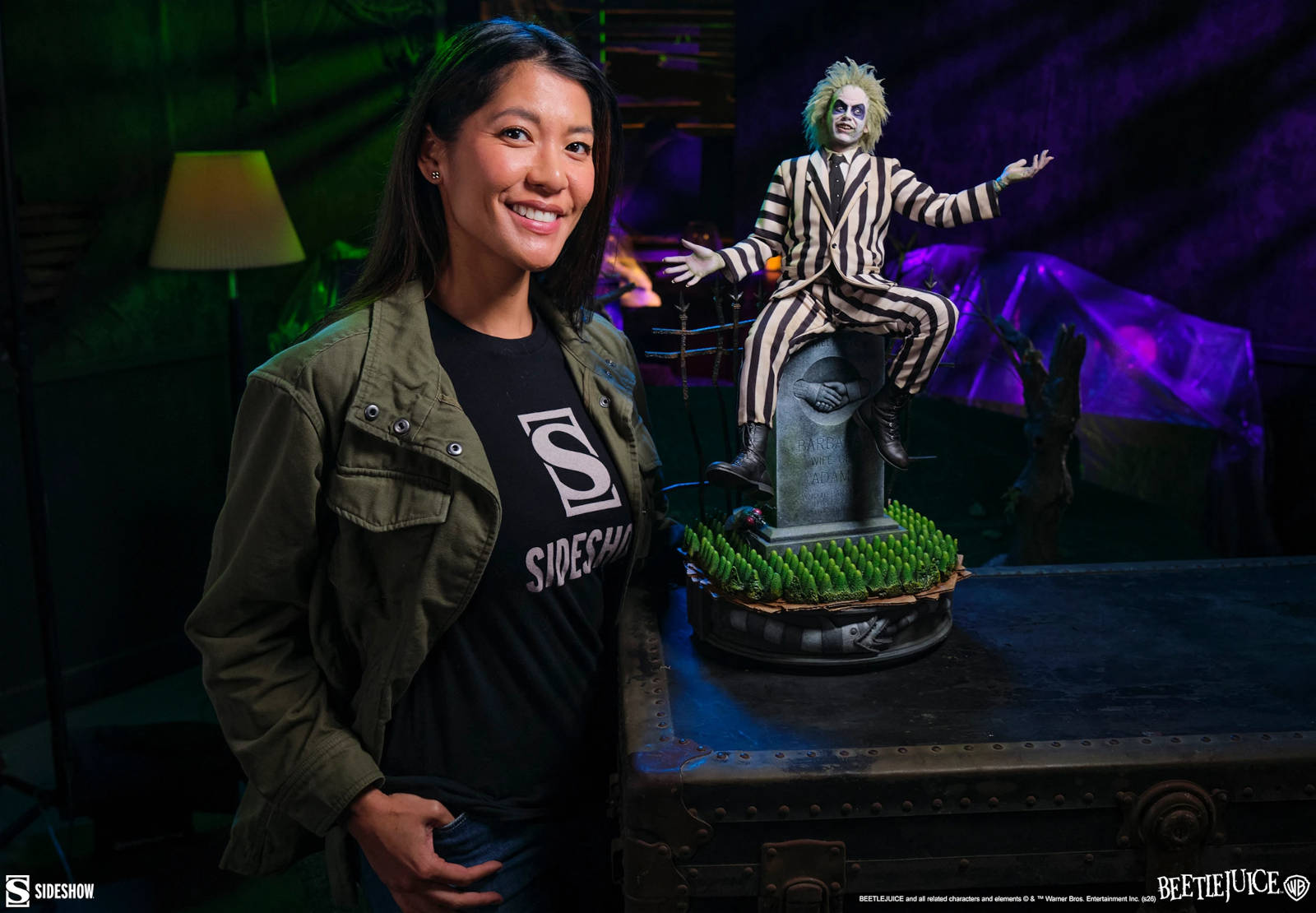 Close-up of the Beetlejuice statue with a detailed view of his face and striped suit.