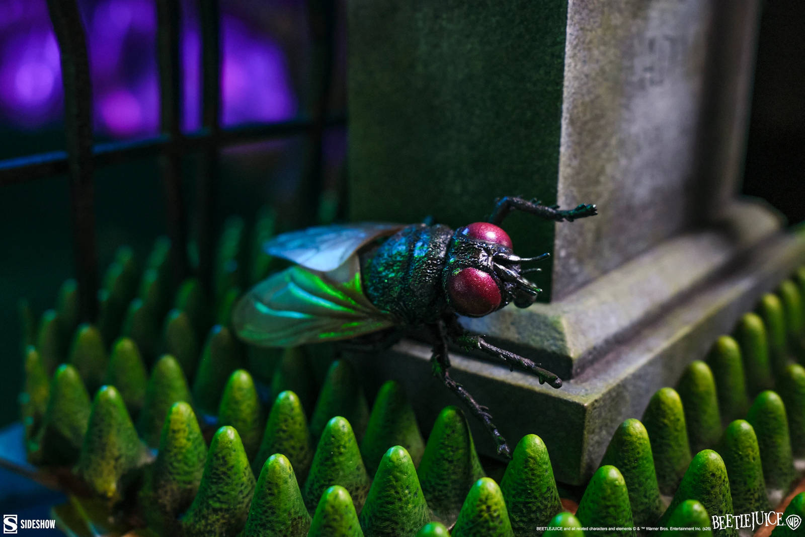 Full front view of the Beetlejuice statue, showcasing his posture and custom-tailored suit.