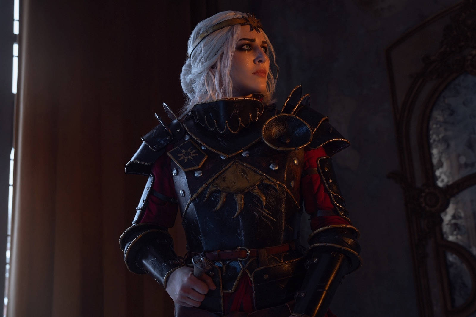 Side profile of Empress Ciri cosplay, highlighting the elaborate design of her attire.